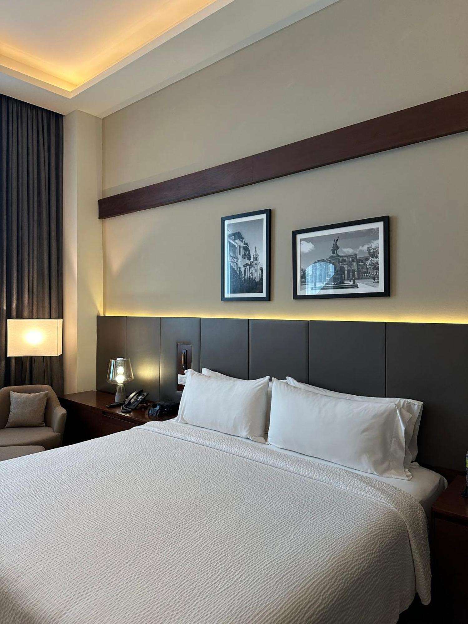 圣多明各假日套房酒店 聖多明哥 外观 照片 A bedroom at the hotel